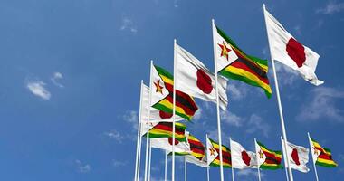 Zimbabwe and Japan Flags Waving Together in the Sky, Seamless Loop in Wind, Space on Left Side for Design or Information, 3D Rendering video