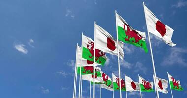 Wales and Japan Flags Waving Together in the Sky, Seamless Loop in Wind, Space on Left Side for Design or Information, 3D Rendering video