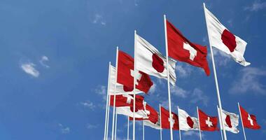 Switzerland and Japan Flags Waving Together in the Sky, Seamless Loop in Wind, Space on Left Side for Design or Information, 3D Rendering video