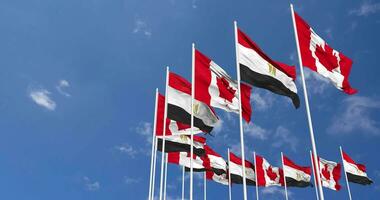 Egypt and Canada Flags Waving Together in the Sky, Seamless Loop in Wind, Space on Left Side for Design or Information, 3D Rendering video