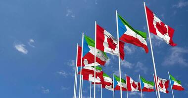 Equatorial Guinea and Canada Flags Waving Together in the Sky, Seamless Loop in Wind, Space on Left Side for Design or Information, 3D Rendering video