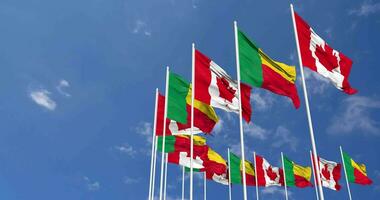 Benin and Canada Flags Waving Together in the Sky, Seamless Loop in Wind, Space on Left Side for Design or Information, 3D Rendering video