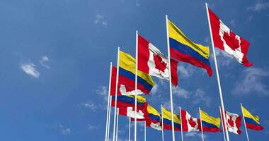 Colombia and Canada Flags Waving Together in the Sky, Seamless Loop in Wind, Space on Left Side for Design or Information, 3D Rendering video