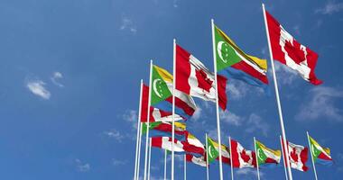 Comoros and Canada Flags Waving Together in the Sky, Seamless Loop in Wind, Space on Left Side for Design or Information, 3D Rendering video