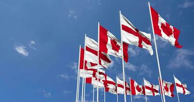 England and Canada Flags Waving Together in the Sky, Seamless Loop in Wind, Space on Left Side for Design or Information, 3D Rendering video