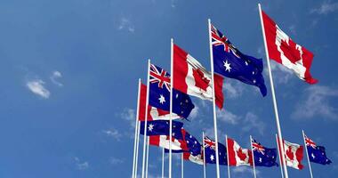 Australia and Canada Flags Waving Together in the Sky, Seamless Loop in Wind, Space on Left Side for Design or Information, 3D Rendering video