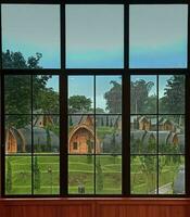 beautiful view of the house from behind the window when it rains photo