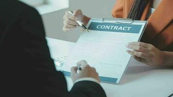 Insurance officers hand over the car keys after the tenant. have signed an auto insurance document or a lease or agreement document Buying or selling a new or used car with a car video