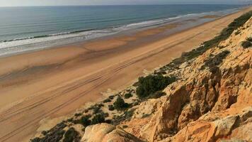 Arenosillo beach, located in Huelva, Spain. Explore the serene beauty of this coastal paradise with its sunlit sandy shores and the rhythmic ebb and flow of the Atlantic Ocean. video