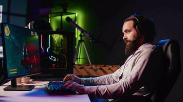 Upset gamer frustrated after losing online competitive multiplayer match playing on cutting edge gaming setup. Man feeling sad after being defeated in science fiction flying videogame video