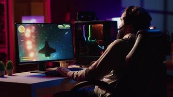 Man upset after losing while playing online multiplayer spaceship videogame. Sad player disappointed after getting flying spacecraft destroyed in flight game, receiving game over message video