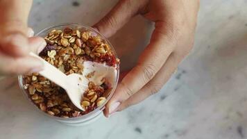 women holding a bowl of breakfast cereal on table video