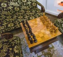 Shot of the vintage chessboard with black and white chess pieces. Concept photo