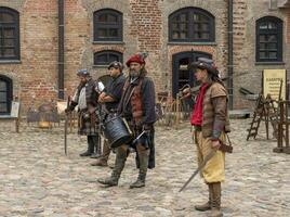 Mir, Belarus - 10.03.2023 -Shot of the the street performers at Mir castle complex. Landmark photo