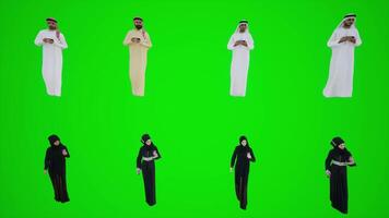 Arab man and women walking in the field and looking at the phone from the front video