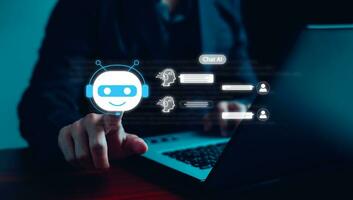 Chatbot Chat with AI. Businessman using technology smart robot AI, conversation assistant, AI Artificial Intelligence concept, digital chatbot on virtual screen, Futuristic technology transformation. photo