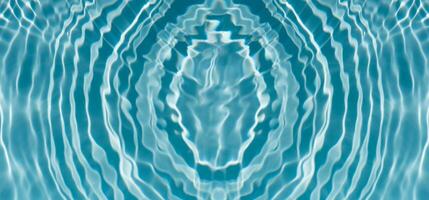Defocus blurred transparent blue colored clear calm water surface texture with splashes and bubbles. Trendy abstract nature background. Water waves in sunlight with copy space. Blue watercolor shining photo