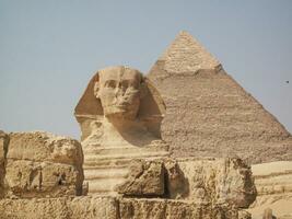 A beautiful picture of the pyramids in Giza in Egypt with the Sphinx photo