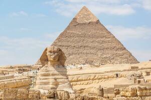 A beautiful picture of the pyramids in Giza in Egypt with the Sphinx photo