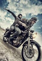 Active couple on motorcycle photo