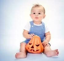 Happy boy with pumpkin photo