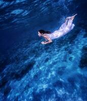 Beautiful female underwater photo
