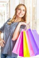 Cheerful girl with shopping bags photo