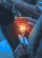 Believer in a church with candle photo