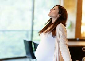 Pregnant woman meditating photo