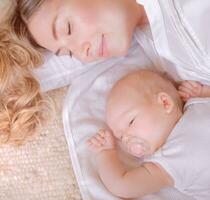 Little baby with mother sleep photo