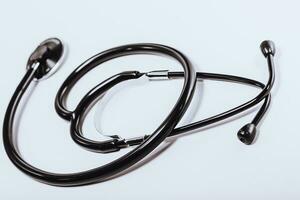 Black stethoscope isolated on white background photo