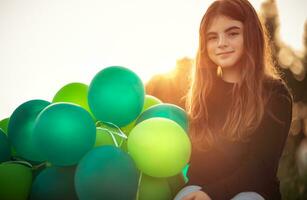 Pretty girl with air balloons photo