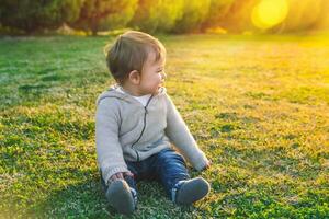 Adorable baby playing outdoors photo