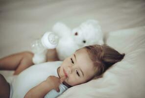 Cute Baby Boy Drinking Formula photo