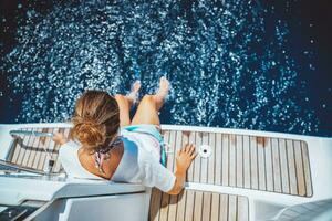 Pretty girl having fun on the yacht photo