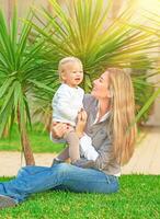 Young happy family on backyard photo