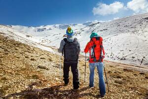 Happy Couple Walking in the Mountains photo