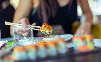 Enjoying sushi plate photo