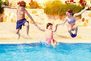 Happy children in the pool photo