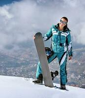 Sporty woman with snowboard photo