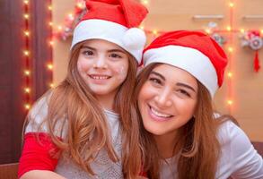 Mother with daughter on the kitchen photo