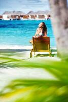 Beautiful woman on the beach photo