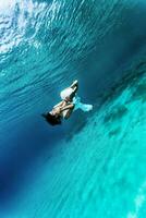 Dancing girl underwater photo