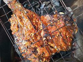 grilled tilapia with a delicious and slightly spicy taste photo