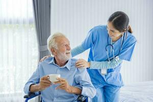 Senior caucasian man get medical service visit from caregiver nurse at home while showing gratitude on appointment for following up on health care and pension welfare insurance concept photo