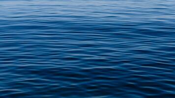 Sea Blue Ocean in Spain with soft gentle ripples on the top surface texture with summer sunlight refracting photo