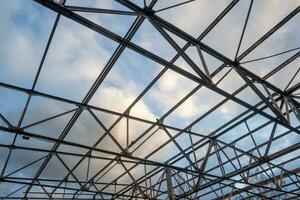 rusted roof truss of an old industrial building photo