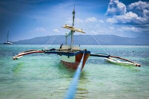 Boat stranded on a paradise beach photo