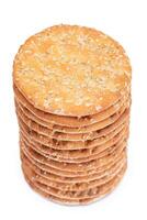 A Stack of Round Salt Crackers with Sesame Isolated on White Background. Dry Snacks - Isolation photo