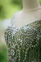 Dress Details. Green wedding dress on mannequi photo